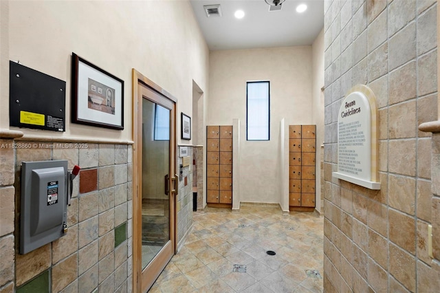 3055 NW 126th Ave Unit 107, Sunrise, FL 33323 - bathroom with tile walls, tile patterned floors, and recessed lighting