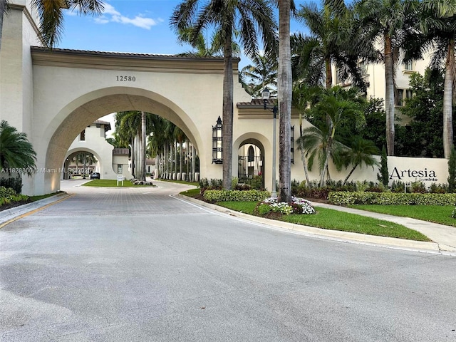 3055 NW 126th Ave Unit 107, Sunrise, FL 33323 - view of asphalt street with curbs and sidewalks