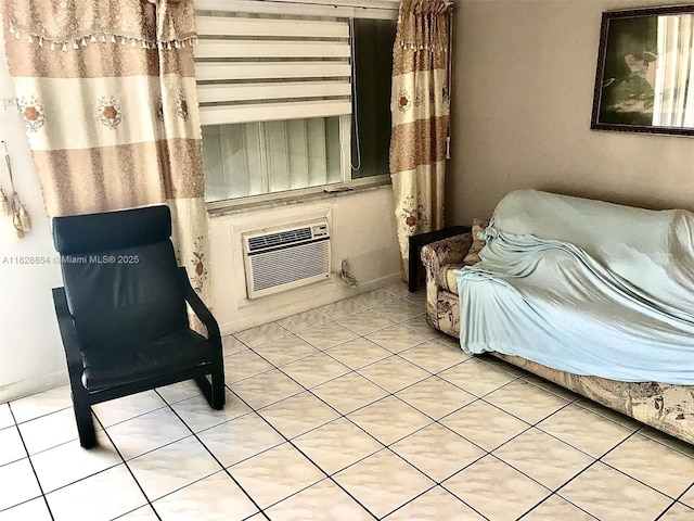 820 SW 11th Ave Unit 16B, Hallandale Beach, FL 33009 - sitting room with light tile patterned flooring and a wall mounted air conditioner