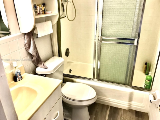 820 SW 11th Ave Unit 16B, Hallandale Beach, FL 33009 - full bath with combined bath / shower with glass door, vanity, and wood finished floors