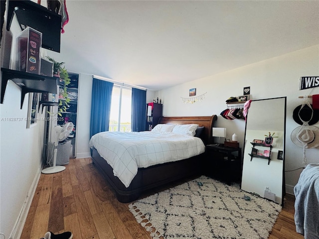 8233 Harding Ave Unit 603, Miami Beach, FL 33141 - bedroom featuring hardwood / wood-style floors and baseboards