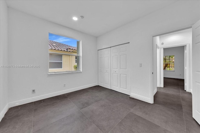 5046 SW 137th Ter, Miramar, FL 33027 - unfurnished bedroom featuring a closet, recessed lighting, and dark tile patterned flooring