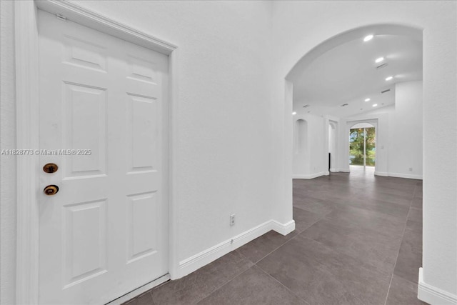 5046 SW 137th Ter, Miramar, FL 33027 - hall with arched walkways, recessed lighting, and dark tile patterned floors