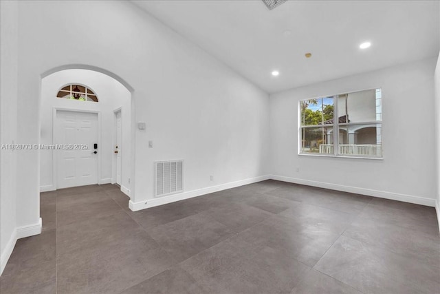 5046 SW 137th Ter, Miramar, FL 33027 - unfurnished room with concrete flooring, arched walkways, and recessed lighting