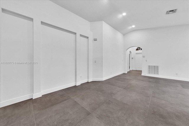 5046 SW 137th Ter, Miramar, FL 33027 - spare room with arched walkways, vaulted ceiling, and recessed lighting