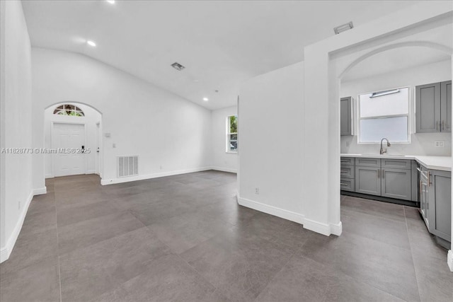 5046 SW 137th Ter, Miramar, FL 33027 - unfurnished room with vaulted ceiling, arched walkways, and recessed lighting