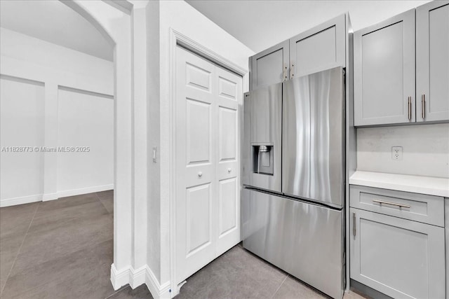 5046 SW 137th Ter, Miramar, FL 33027 - kitchen with stainless steel fridge, gray cabinets, and light countertops