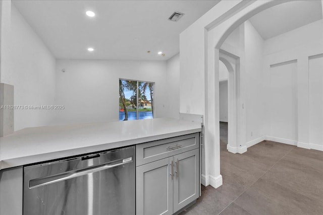 5046 SW 137th Ter, Miramar, FL 33027 - kitchen with stainless steel dishwasher, arched walkways, recessed lighting, light countertops, and gray cabinets