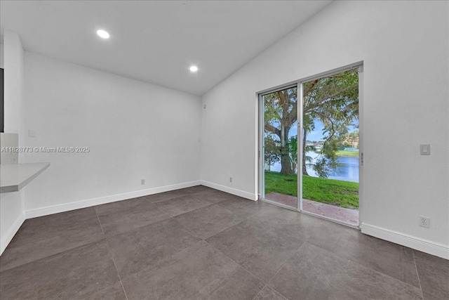 5046 SW 137th Ter, Miramar, FL 33027 - unfurnished room featuring lofted ceiling, a water view, concrete floors, and recessed lighting