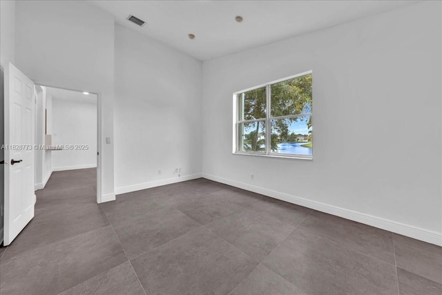 5046 SW 137th Ter, Miramar, FL 33027 - empty room with baseboards and concrete floors