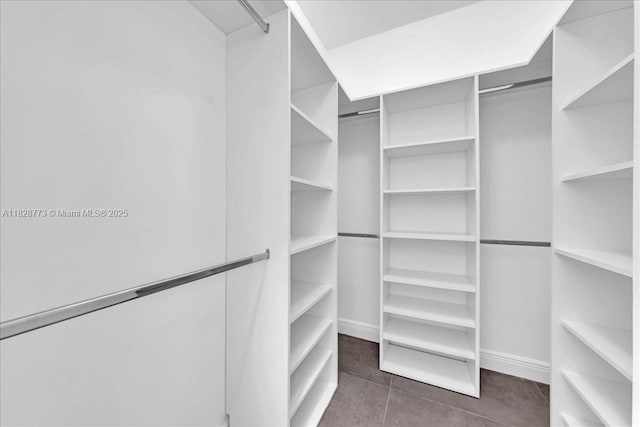 5046 SW 137th Ter, Miramar, FL 33027 - spacious closet featuring dark tile patterned floors