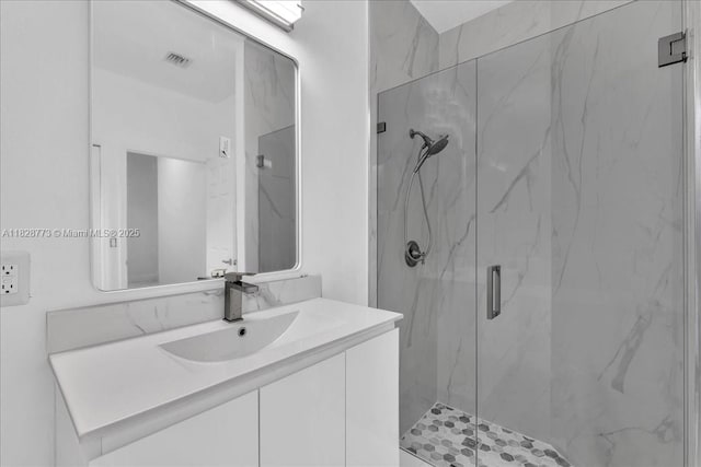 5046 SW 137th Ter, Miramar, FL 33027 - full bathroom featuring a marble finish shower and vanity