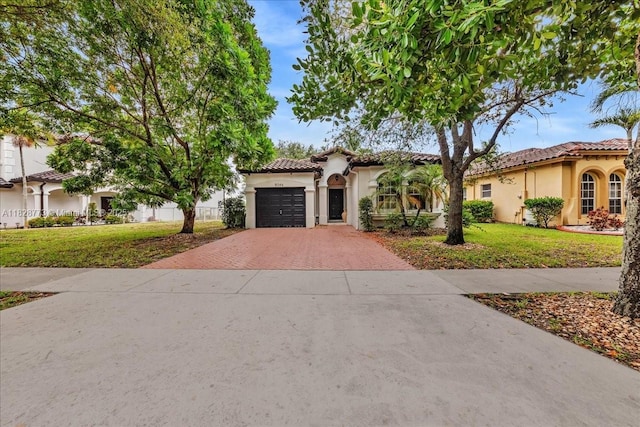 5046 SW 137th Ter, Miramar, FL 33027 - mediterranean / spanish house with decorative driveway, stucco siding, a tile roof, and a front lawn