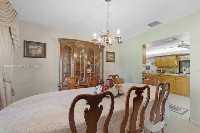 31260 SW 202nd Ave, Homestead, FL 33030 - dining space featuring a chandelier, a ceiling fan, and light carpet