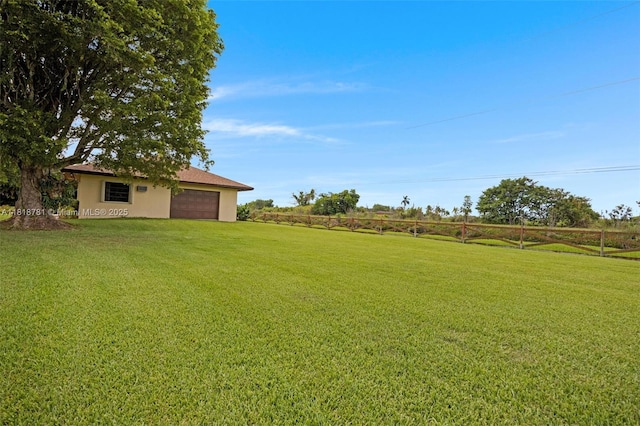 31260 SW 202nd Ave, Homestead, FL 33030 - view of grassy yard with an attached garage