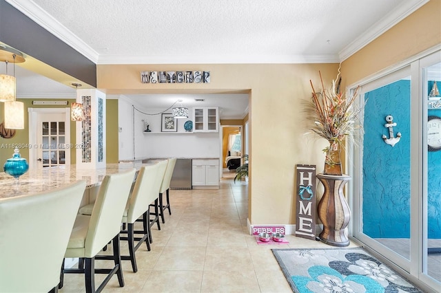7306 NW 95th Way, Tamarac, FL 33321 - dining room with ornamental molding, light tile patterned flooring, and a textured ceiling