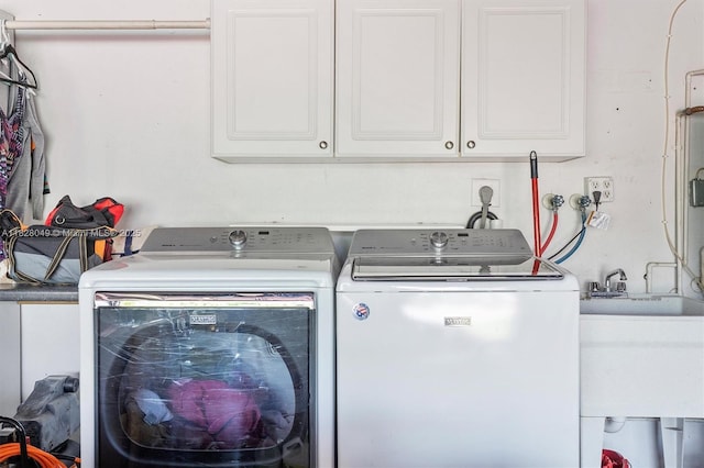 7306 NW 95th Way, Tamarac, FL 33321 - laundry area featuring washer and clothes dryer and cabinet space