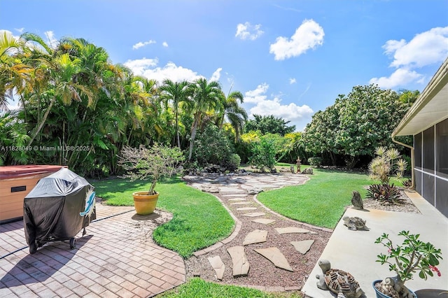7306 NW 95th Way, Tamarac, FL 33321 - view of green lawn featuring a sunroom and a patio