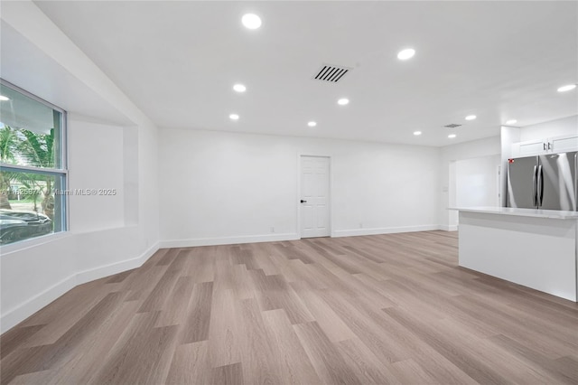 4290 NW 38th Ave, Lauderdale Lakes, FL 33309 - empty room featuring light wood-type flooring and recessed lighting