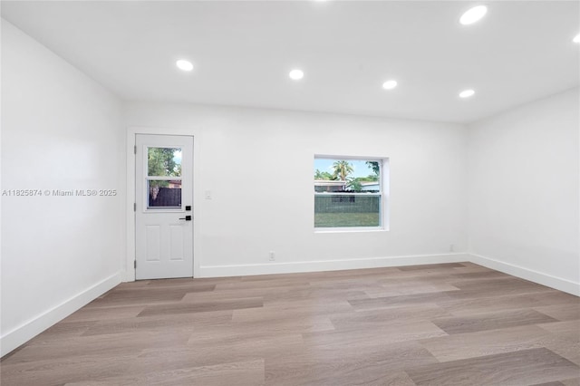 4290 NW 38th Ave, Lauderdale Lakes, FL 33309 - empty room featuring plenty of natural light, recessed lighting, and light wood-style floors