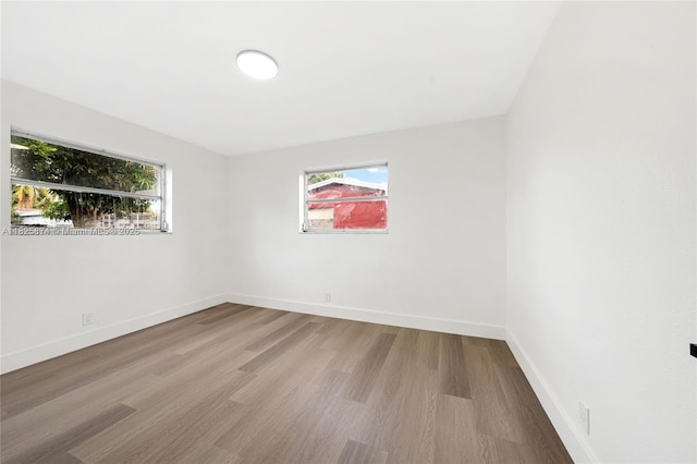4290 NW 38th Ave, Lauderdale Lakes, FL 33309 - empty room with wood finished floors and baseboards