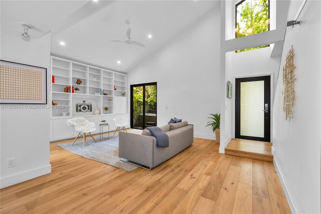 2427 Tequesta Ln, Miami, FL 33133 - living area featuring high vaulted ceiling, light wood-style floors, ceiling fan, and recessed lighting