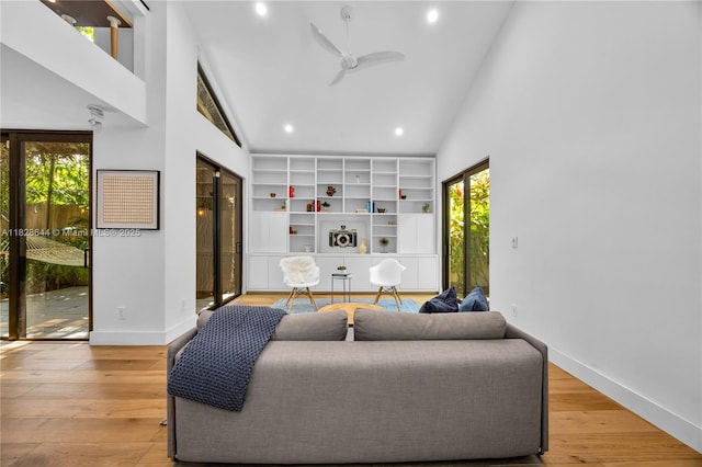 2427 Tequesta Ln, Miami, FL 33133 - living area featuring high vaulted ceiling, healthy amount of natural light, ceiling fan, recessed lighting, and wood finished floors
