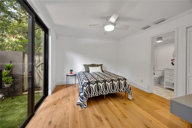 2427 Tequesta Ln, Miami, FL 33133 - bedroom with light wood-type flooring, ornamental molding, ensuite bath, and ceiling fan