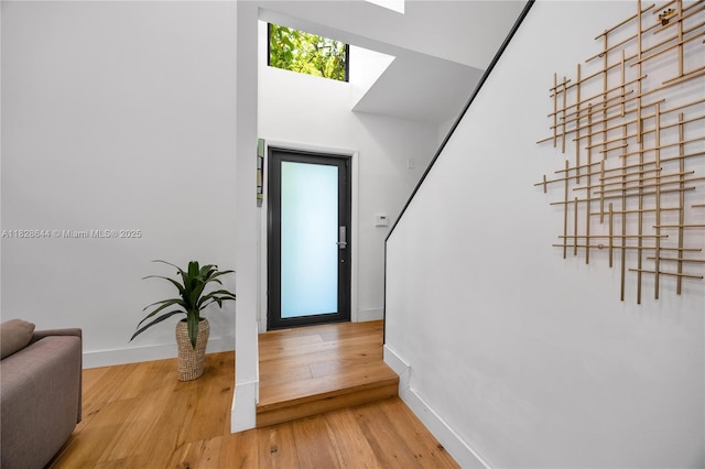 2427 Tequesta Ln, Miami, FL 33133 - foyer entrance with a skylight and wood finished floors