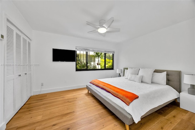 2427 Tequesta Ln, Miami, FL 33133 - bedroom with light wood-style flooring, a closet, and ceiling fan