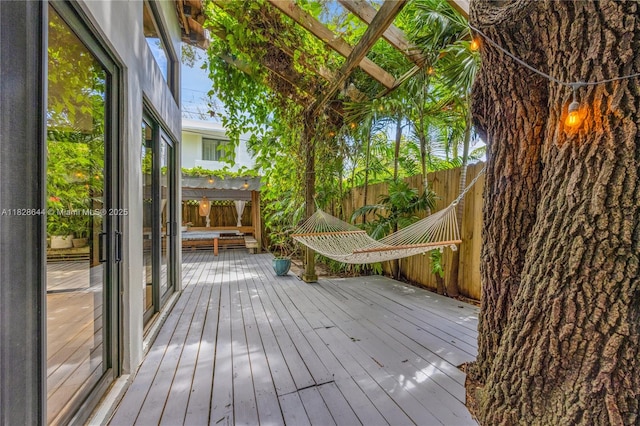 2427 Tequesta Ln, Miami, FL 33133 - wooden terrace with a fenced backyard