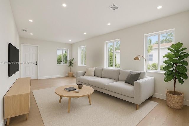 3455 E 1st Ct, Hialeah, FL 33013 - living area with plenty of natural light, recessed lighting, and light wood finished floors