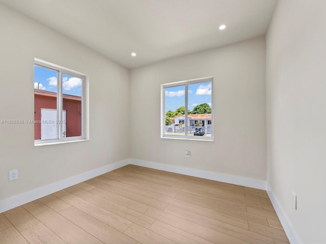 3455 E 1st Ct, Hialeah, FL 33013 - spare room with light wood-style floors and recessed lighting