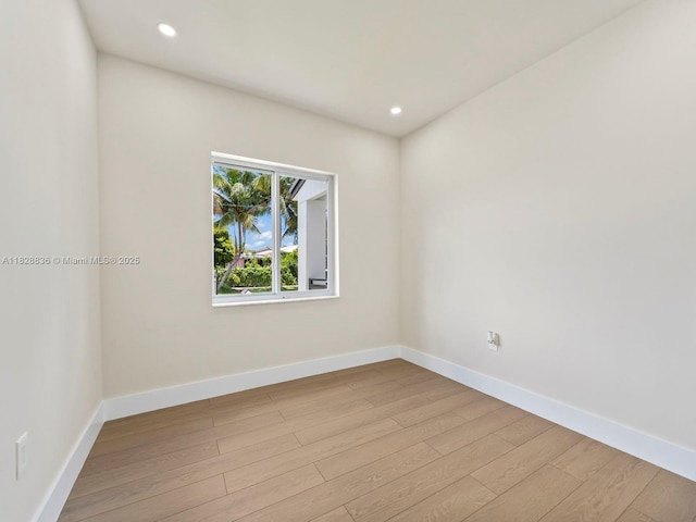 3455 E 1st Ct, Hialeah, FL 33013 - spare room featuring light wood-type flooring and recessed lighting