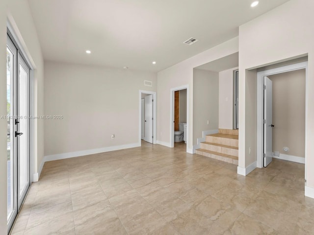 3455 E 1st Ct, Hialeah, FL 33013 - spare room featuring stairs and recessed lighting