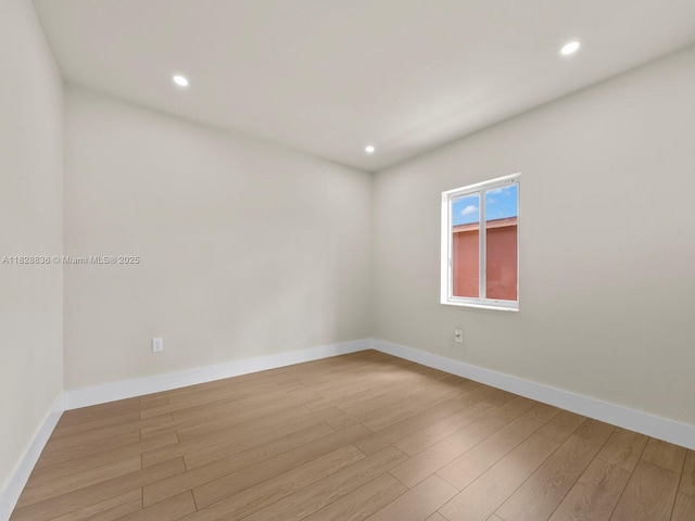 3455 E 1st Ct, Hialeah, FL 33013 - unfurnished room with wood finished floors and recessed lighting