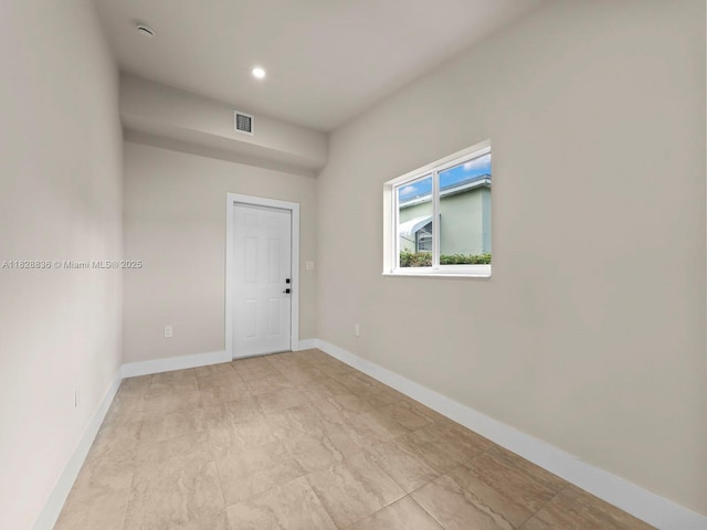 3455 E 1st Ct, Hialeah, FL 33013 - spare room with a smoke detector and recessed lighting