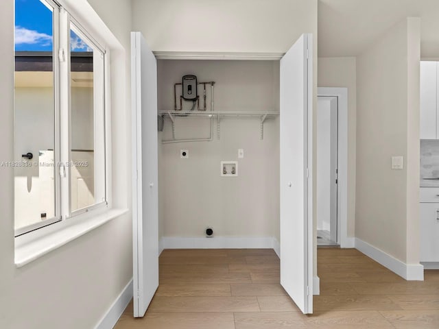 3455 E 1st Ct, Hialeah, FL 33013 - washroom featuring hookup for an electric dryer, washer hookup, and light wood-style floors
