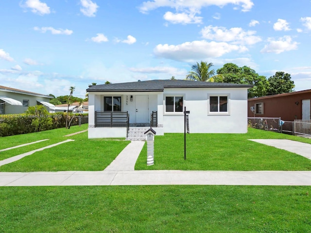 3455 E 1st Ct, Hialeah, FL 33013 - view of front of property featuring covered porch and stucco siding