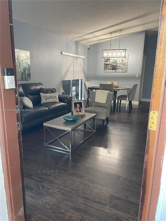 7525 SW 153rd Pl Unit 203-11, Miami, FL 33193 - living room with hardwood / wood-style floors and a textured ceiling