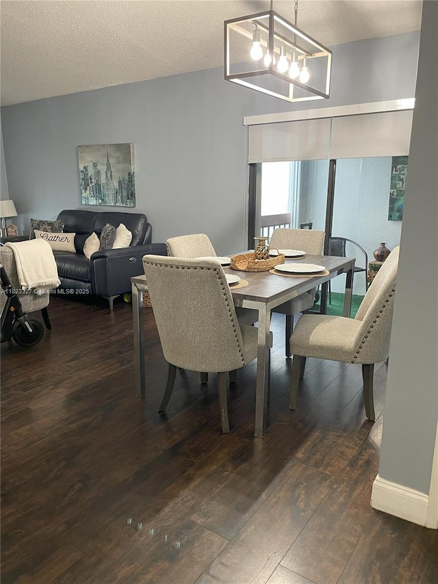 7525 SW 153rd Pl Unit 203-11, Miami, FL 33193 - dining space with dark wood finished floors and a chandelier