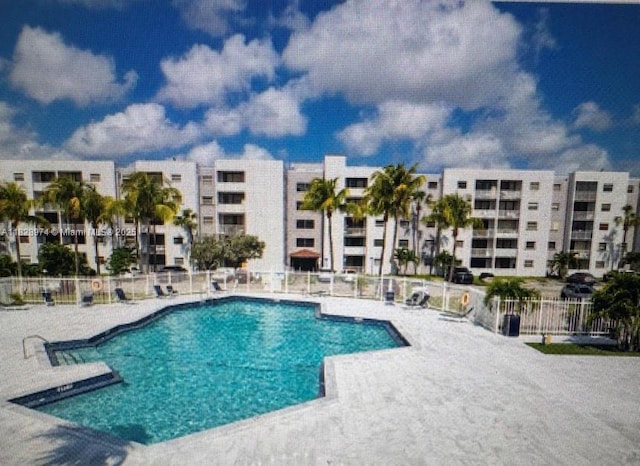 8075 NW 7th St Unit 318, Miami, FL 33126 - community pool with a patio area