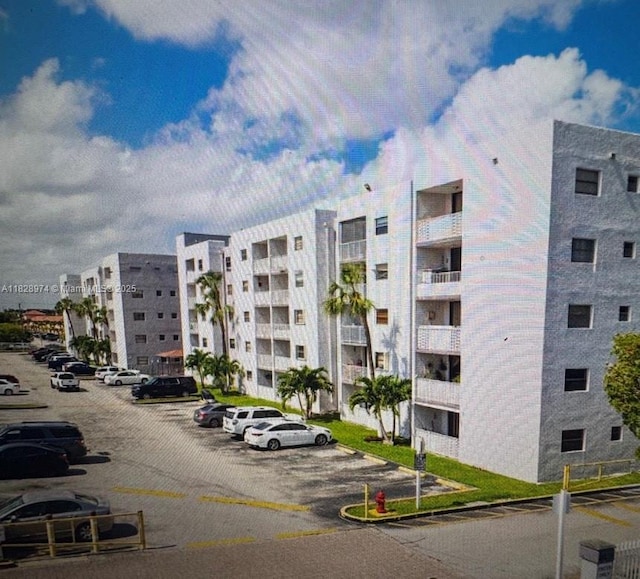 8075 NW 7th St Unit 318, Miami, FL 33126 - view of apartment building / complex with uncovered parking