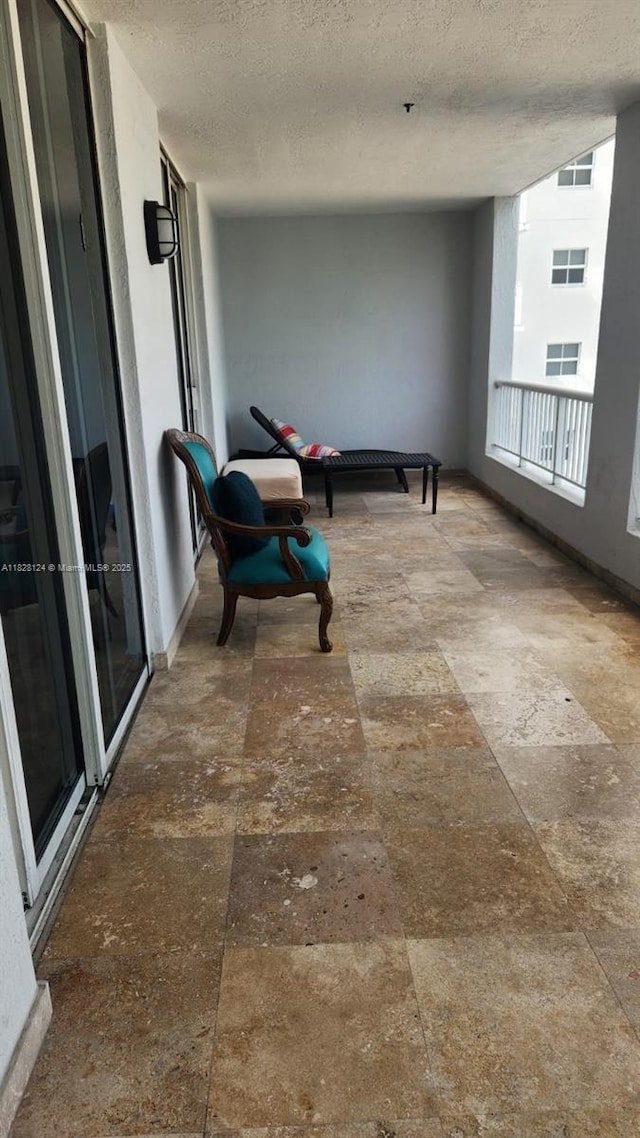 170 SE 14th St Unit 2405, Miami, FL 33131 - hallway with a textured ceiling and baseboards