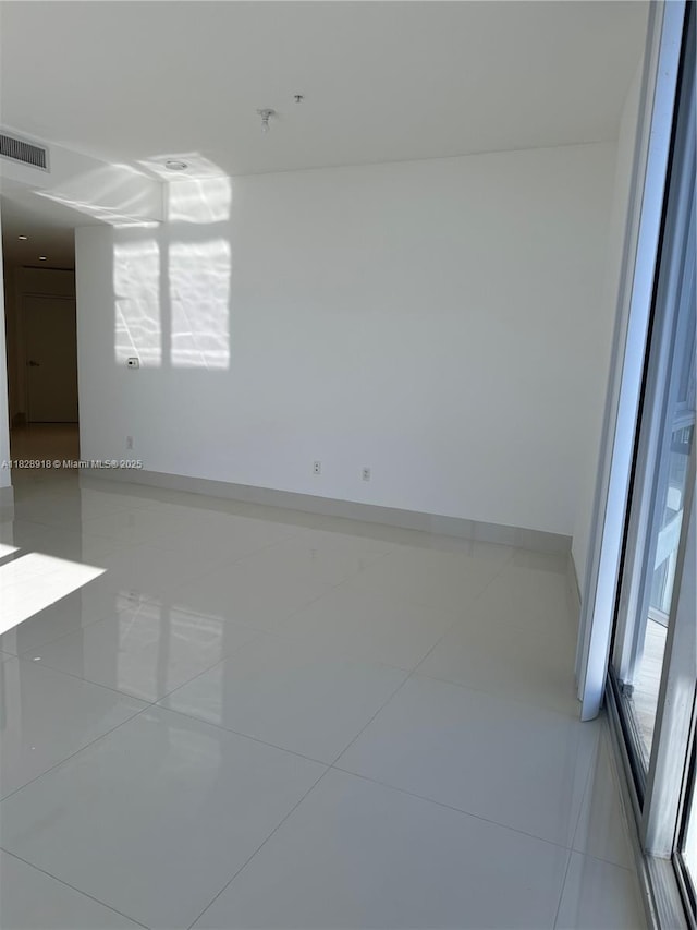 1010 SW 2nd Ave Unit Ph06, Miami, FL 33130 - empty room with tile patterned flooring and baseboards