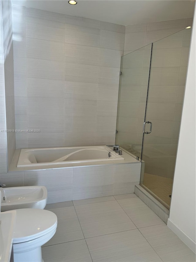 1010 SW 2nd Ave Unit Ph06, Miami, FL 33130 - bathroom with a bath, a shower stall, tile patterned flooring, and a bidet