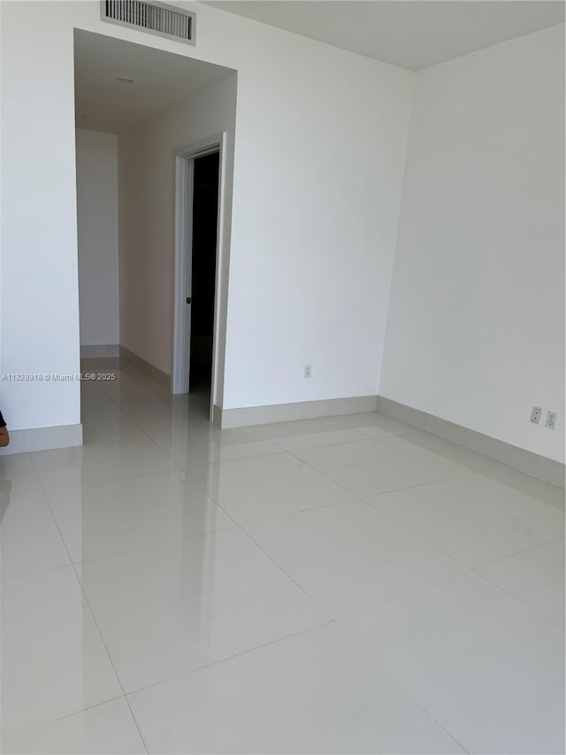 1010 SW 2nd Ave Unit Ph06, Miami, FL 33130 - empty room with light tile patterned floors and baseboards