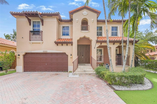 2620 SW 150th Ct, Miami, FL 33185 - mediterranean / spanish home featuring stucco siding, a tile roof, an attached garage, and decorative driveway