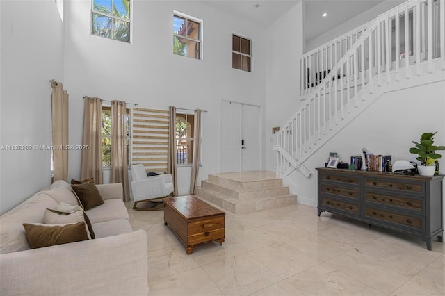 2620 SW 150th Ct, Miami, FL 33185 - living area with stairway, light marble finish flooring, and a towering ceiling