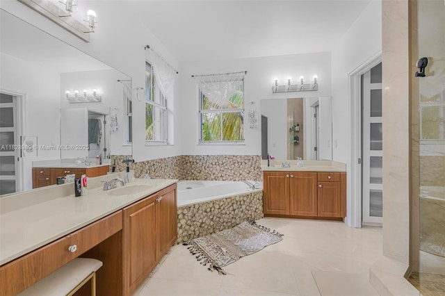 2620 SW 150th Ct, Miami, FL 33185 - full bathroom featuring two vanities, a bath, a stall shower, tile patterned floors, and a closet
